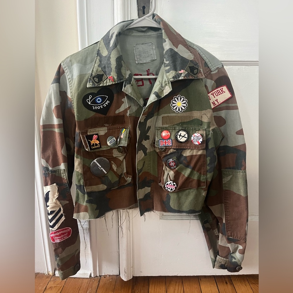 vintage army surplus jacket hand embroidered with vintage patches and pins